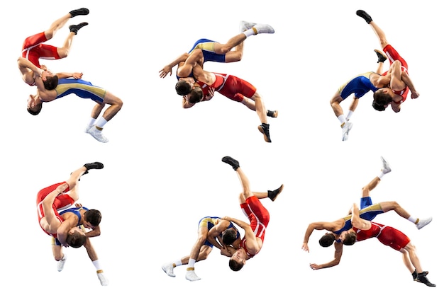 A set of high wrestling throws tricks Two young male athletes in blue and red wrestling tights wrestling on a white background