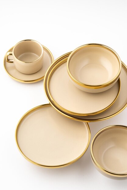 A Set of light brown ceramic plate and cup on a white background