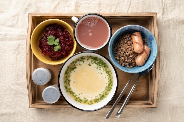 Set lunch in bowls in a wooden serving box