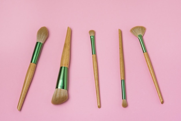 Set of Makeup Brushes on Pink Background Minimal Flat Lay Horizontal