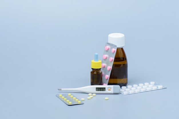 Set of medicine in a supermarket cart on a white background. Concept of treatment and prevention