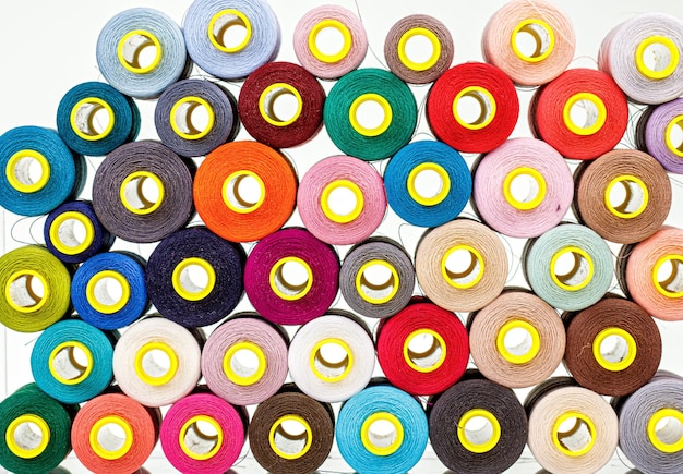 Set of multicolored spools of thread for sewing