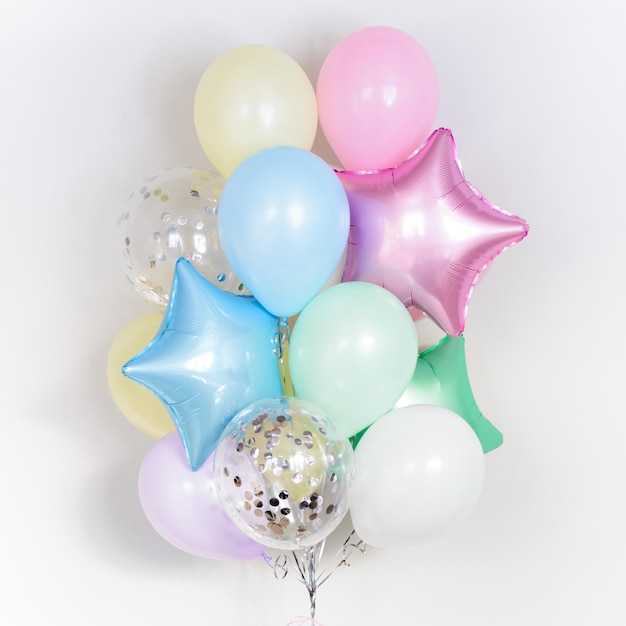 Set of multicolour foil helium balloons in form of stars Concept of holiday happy birthday