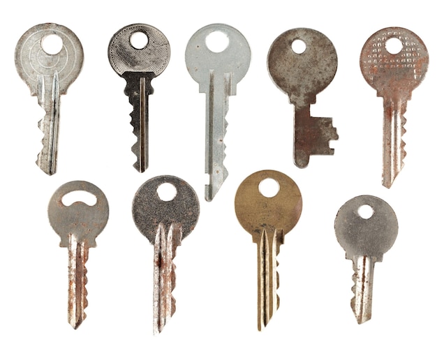 Set of old keys from door locks isolated on white background.