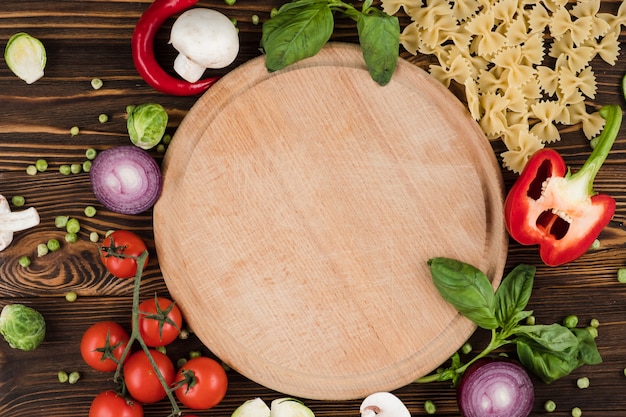 Set of pasta products, board top view