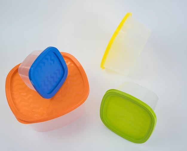 Set of plastic food containers on white background