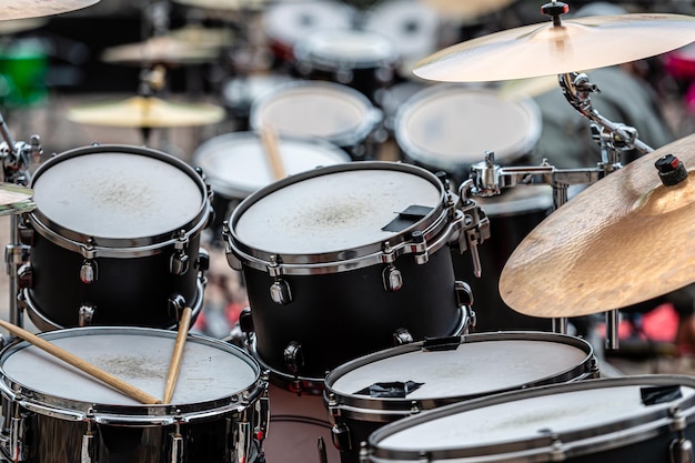 A set of plates in a drum set At a concert of percussion music selective focus closeup