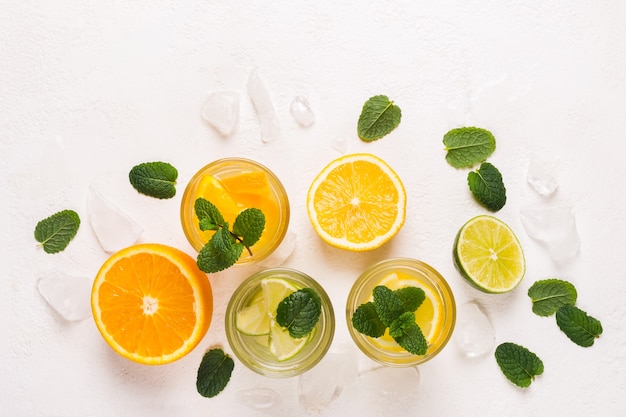 Set of refreshing lemonade or detox water with citrus and mint.