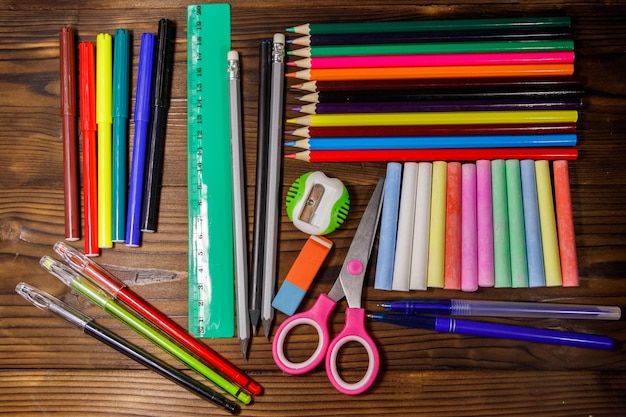 Set of school stationery supplies on wooden desk. Back to school concept