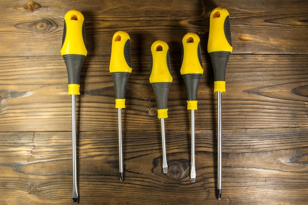 Set of screwdrivers on wooden background