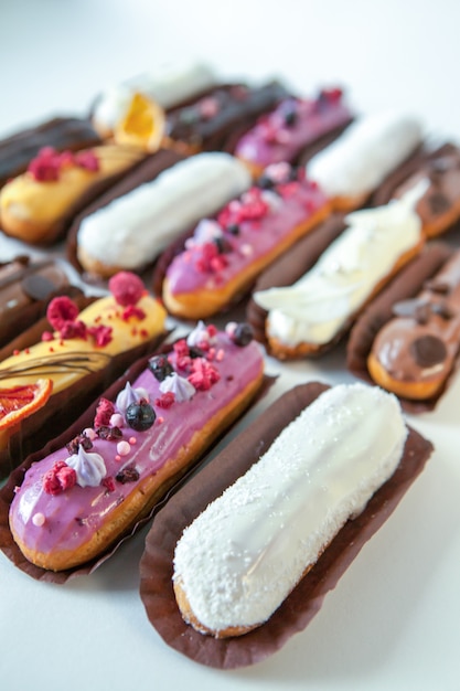 Set of several eclairs with various fillings and design