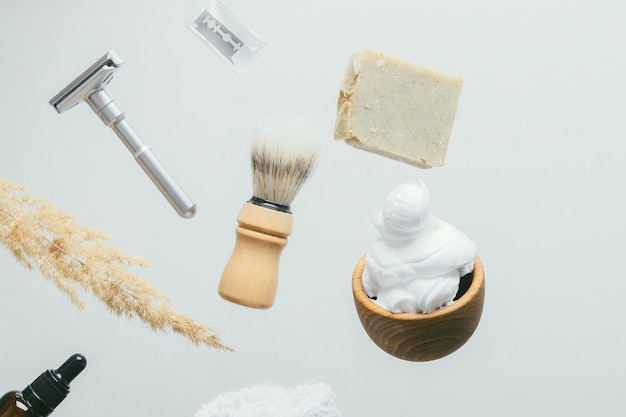 Set for shaving with metal safe razor wooden brush and soap