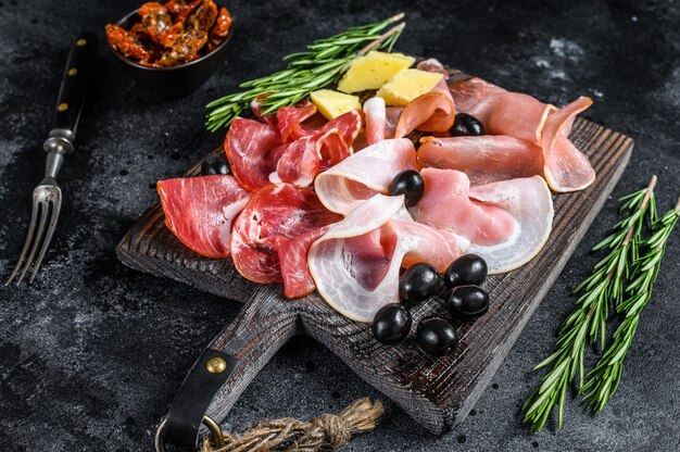 Photo set of smoked and dried meat ham, jerky, salted meat, jamon and herbs.