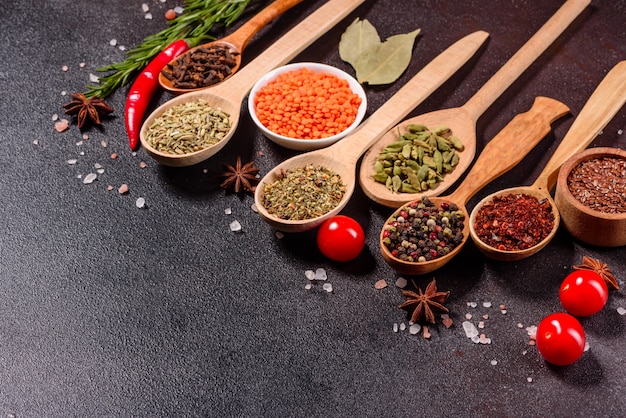 A set of spices and herbs. Indian cuisine. Pepper, salt, paprika, basil and other. Top view.