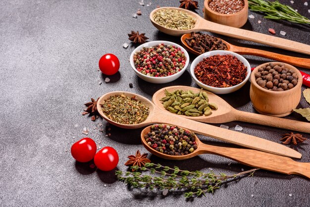 A set of spices and herbs. Indian cuisine. Pepper, salt, paprika, basil and other. Top view.