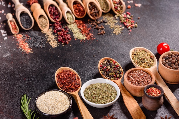 A set of spices and herbs. Indian cuisine. Pepper, salt, paprika, basil. Top view.