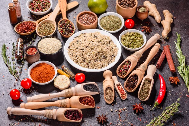 A set of spices and herbs. Indian cuisine. Pepper, salt, paprika, basil. Top view.