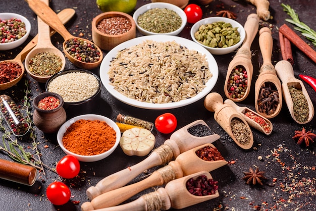 A set of spices and herbs. Indian cuisine. Pepper, salt, paprika, basil. Top view.