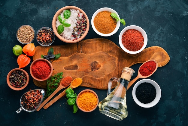 A set of spices and herbs on a stone table Indian traditional spices Top view Free copy space