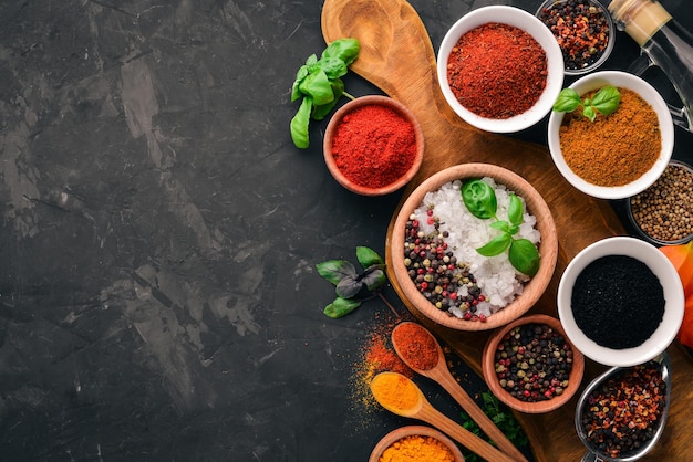 A set of spices and herbs on a stone table Indian traditional spices Top view Free copy space