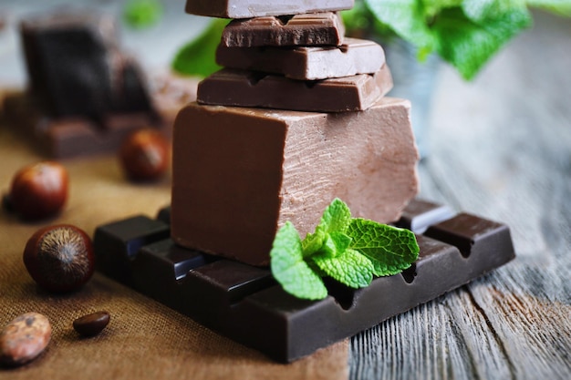 Set of spicy chocolate on wooden table closeup