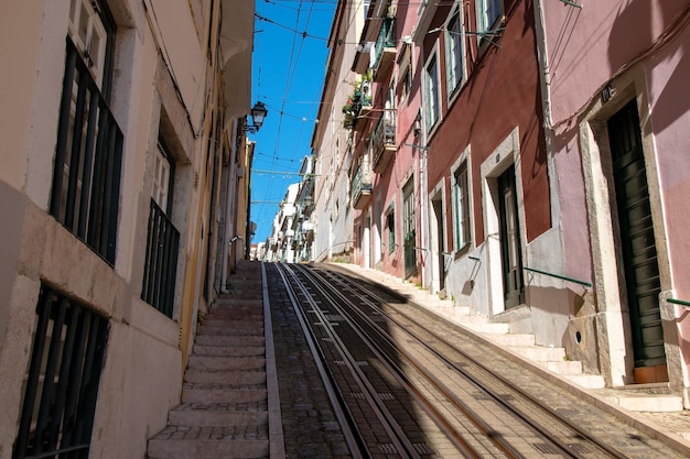 a set of stairs with a train going down the tracks