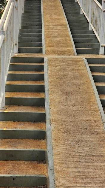 a set of stairs with a yellow line on the bottom.