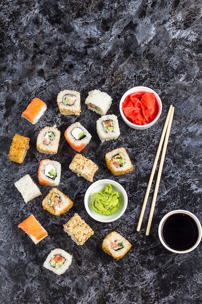 Set of sushi and maki on stone table Top view with copy space