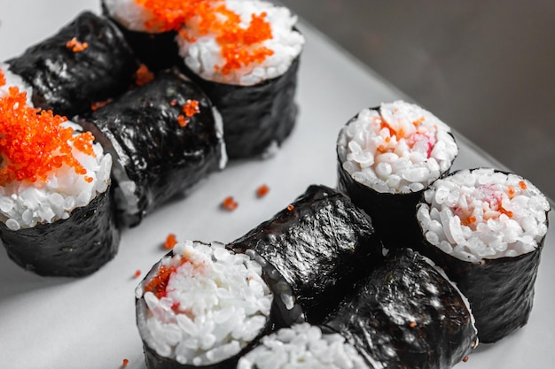 Set of sushi and maki on white background Flat lay top view