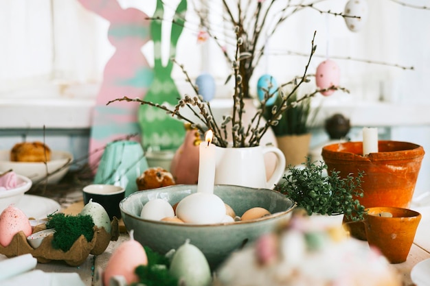 Set table for Easter party setting for celebration of Happy Easter in country house spring rustic style