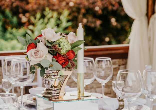 Set table at a wedding banquet in the park.