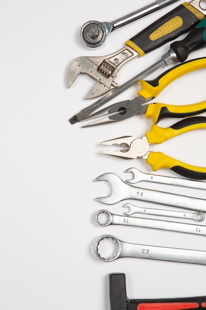 Set of tools for repair in a case on a white background Assorted work or construction tools