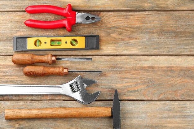 Photo set of tools on wooden 