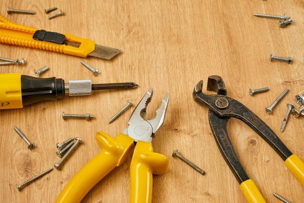 Set of various construction tools on a wooden background. Tools for home repair.