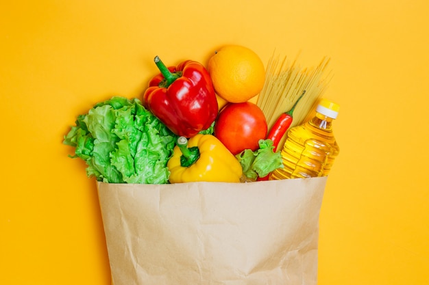 A set of vegetarian food on an orange space, flat lay