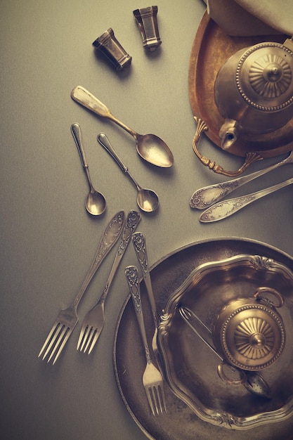 Set of vintage dinnerware on gray table