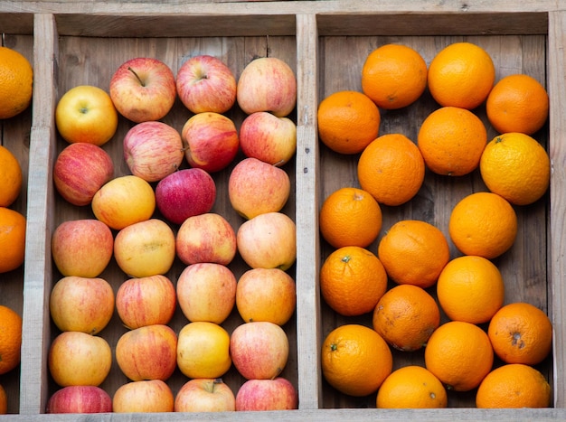 A set of vitamins A boxes with apples and oranges