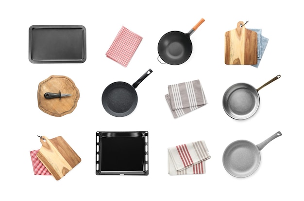 Set with pans cookware and kitchen utensils on white background top view