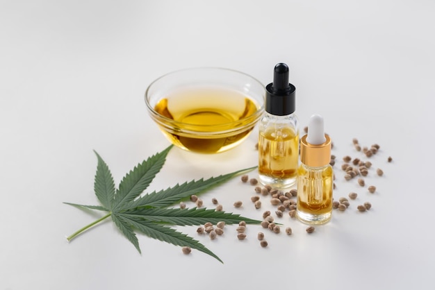 Sets of legalized marijuana features with CBD oil in bottle with dropper lid