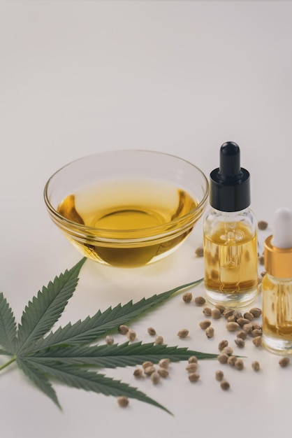 Sets of legalized marijuana features with CBD oil in bottle with dropper lid