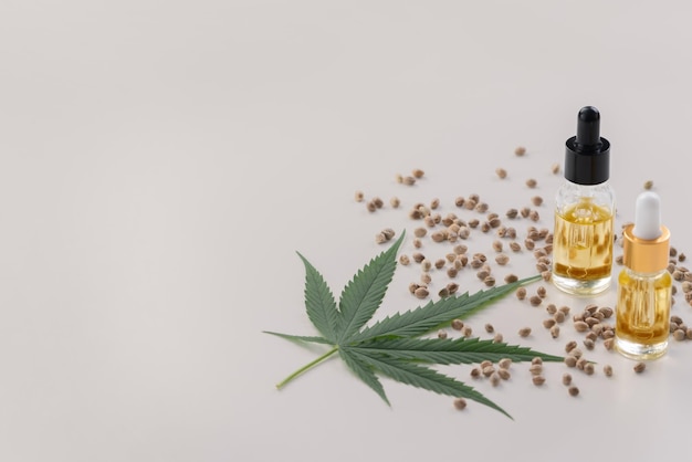 Sets of legalized marijuana features with CBD oil in bottle with dropper lid