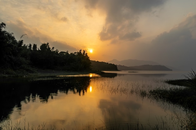 The setting sun dyed the sky and the lake yellow