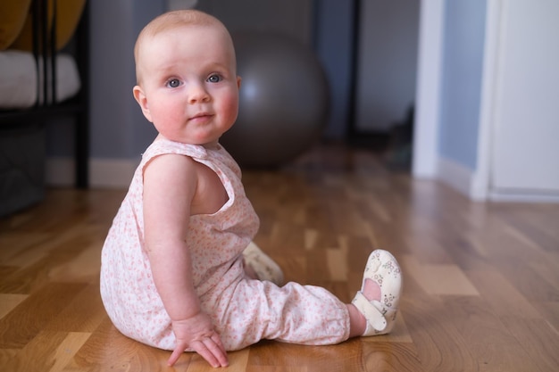 Seven months old caucasian baby on the floor