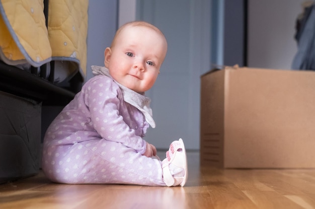 Seven months old caucasian baby on the floor