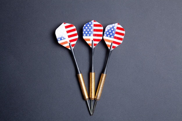 Several darts on a black background