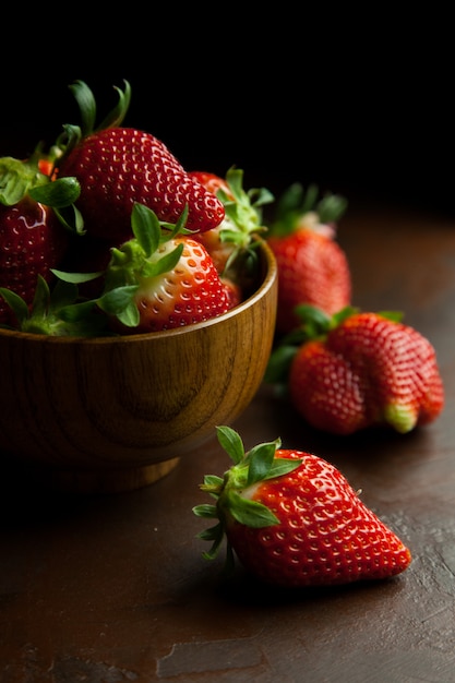 Several fresh strawberries in a bowl