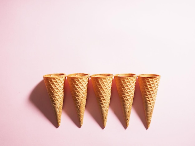 Several ice cream waffle cups on a colored background with a clear shadow A range of waffle cups