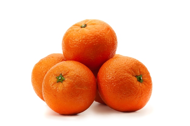 Several oranges lie on a white with a shadow