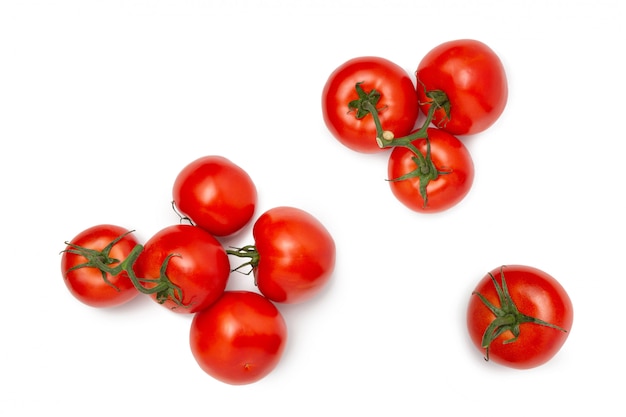 Several tomatoes on a white isolated background. Fresh vegetables. Flat lay.