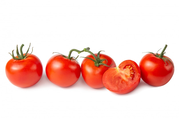 Several tomatoes on a white isolated background. Fresh vegetables.